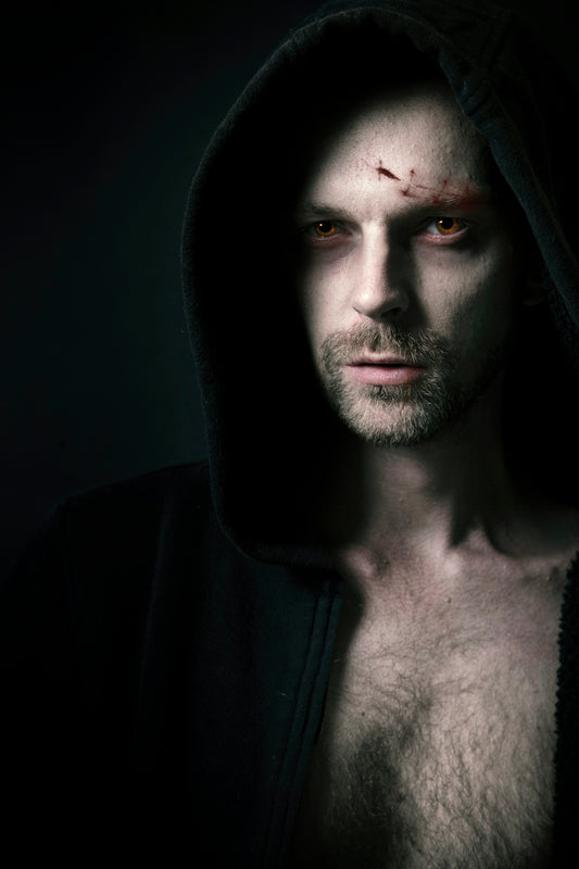 man in black hoodie with black beard